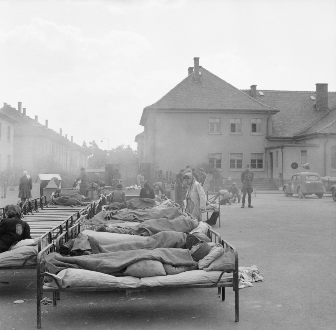 Former Wehrmacht barracks in Belsen: Open-air emergency hospital, 27 April 1945. Photo by Sgt. Oakes. Imperial War Museum, London, Photograph Archive, BU 4844.