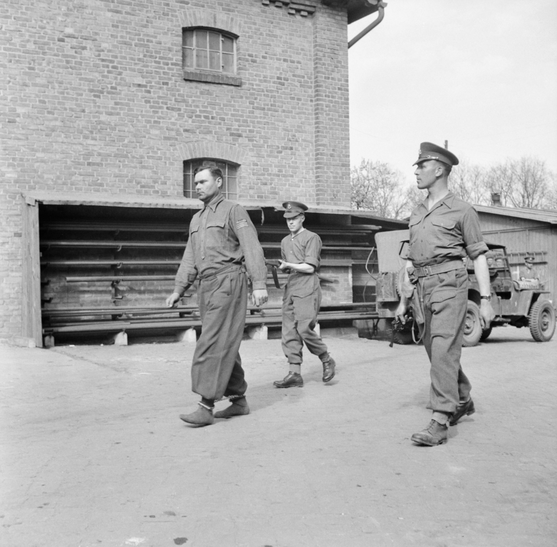 Former camp commandant Josef Kramer being led away by British military police, 18 April 1945. Photo by Sgt. Midgley. Imperial War Museum, London, Photograph Archive, BU 3822.